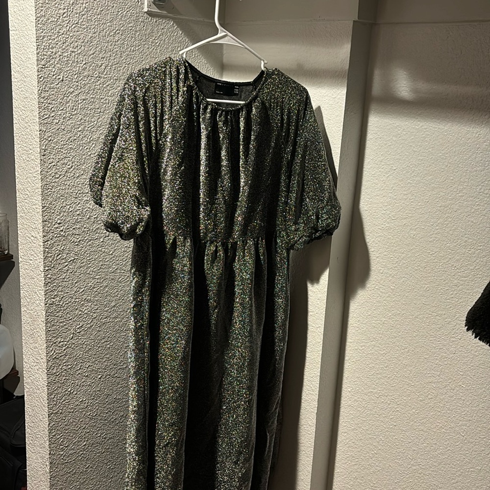 Silver shimmery midi dress with sleeves.